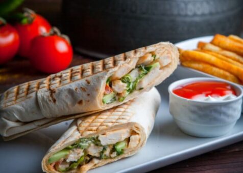 side-view-shawarma-pita-roll-with-chicken-fried-potatoes_176474-3216